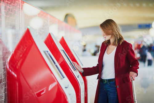 Young woman in international airport photo