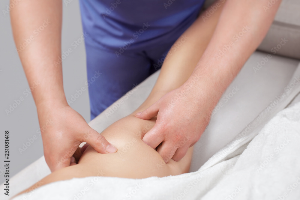 The masseur makes Anti-cellulite massage on the buttock and thighs of the patient. Treatment of excess weight. The masseur makes Anti-cellulite massage on the buttock and thighs of the patient. Treatment of excess weight.