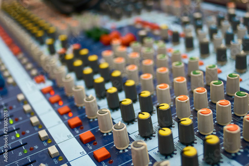The big control desk of mixing console. the series of encoders