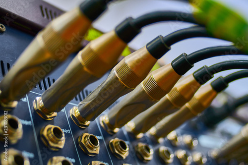 The rear of sound equipment, connectors and plugs