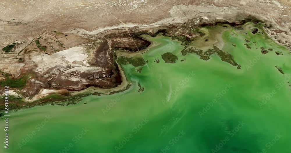 Very high-altitude circular tracking shot of the Caspian Sea coast, Kazakhstan. Reversible, seamless loop. Elements of this image furnished by NASA Very high-altitude circular tracking shot of the Caspian Sea coast, Kazakhstan. Reversible, seamless loop. Elements of this image furnished by NASA