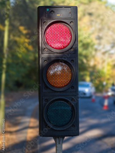 Close-up of temporary portable traffic signal for road works.