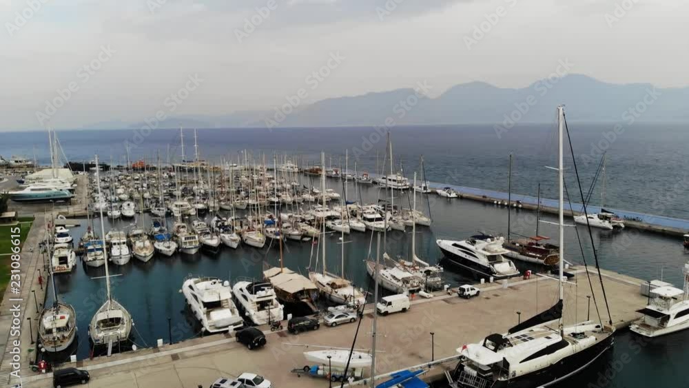 Aerial view of the Marina. Parking boats from a height. Port with yachts. City pier. Aerial view. 4K Aerial view of the Marina. Parking boats from a height. Port with yachts. City pier. Aerial view. 4K