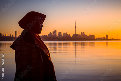 Photography A pregnant muslim women pose by the Ontario Lake Canada