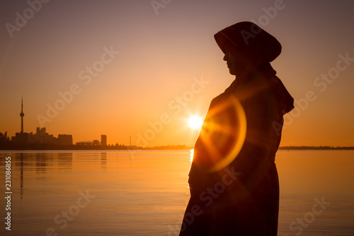 Photography A pregnant muslim women pose by the Ontario Lake Canada