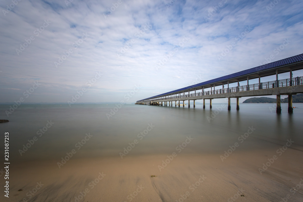 A Beautiful long exposure picture of a jetty. Image contain certain grain or noise and soft focus when view at full resolution