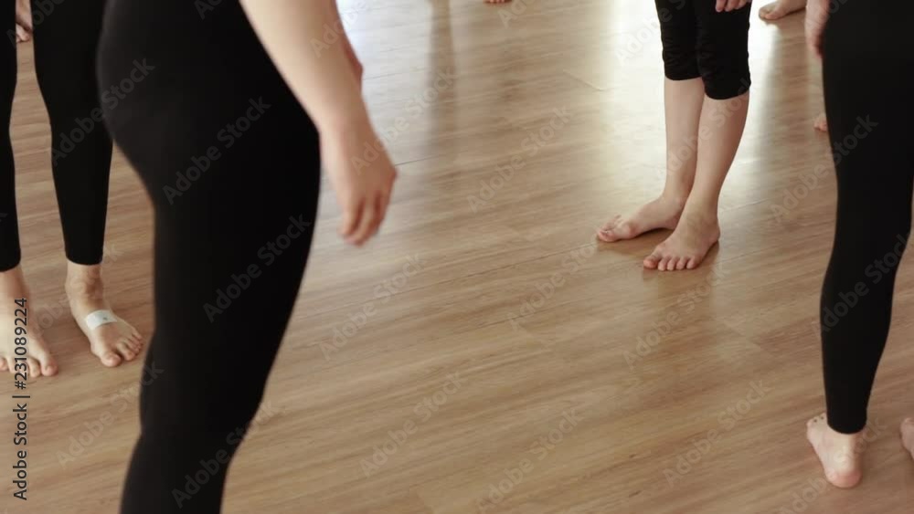 Girls to dance class. Girls in black clothes dancing in the dance hall. Choreography with jumps. Slow motion Girls to dance class. Girls in black clothes dancing in the dance hall. Choreography with jumps. Slow motion