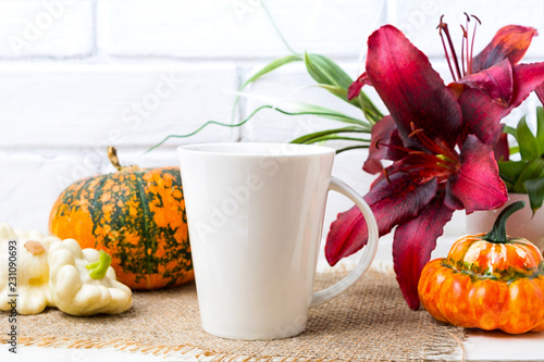 White big coffee latte mug mockup with pumpkin and red lily photo