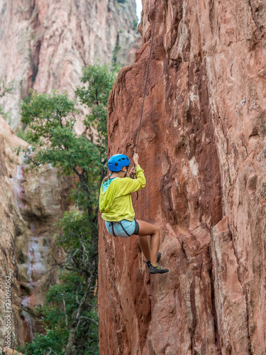 A girl doing rock climbing