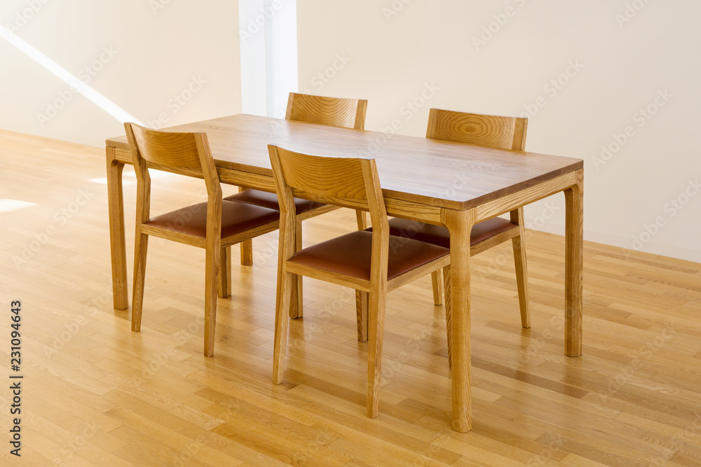 a four-person wooden table and chair