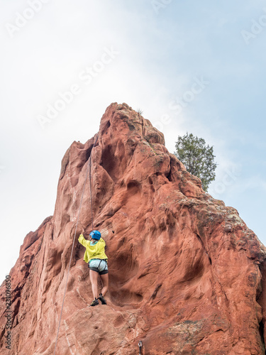 A girl doing rock climbing