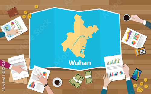 wuhan hubei china city region economy growth with team discuss on fold maps view from top