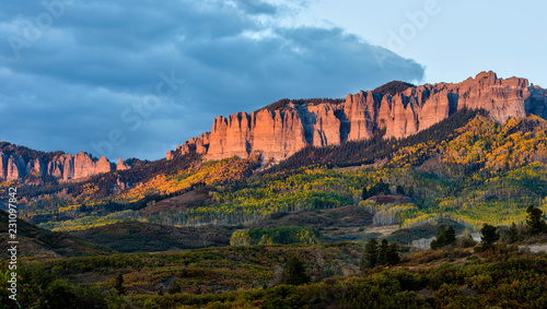 Sunset at Cimarron Ridge - Autumn sunset view of the rugged Cimarron Ridge South, 11,526 ft (3,513 m), part of the San Juan Mountains, seen from Owl Creek Pass Road, near Ridgeway, Colorado, USA.