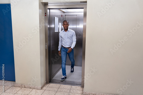 Man Coming Out From An Elevator