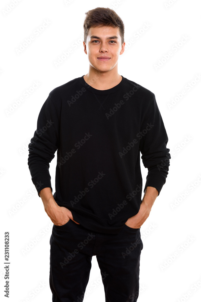 Studio shot of young handsome man standing Studio shot of young handsome man standing