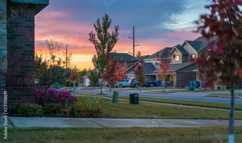 Living in Residential Housing Neighborhood Street at Sunset in Bentonville Arkansas photo