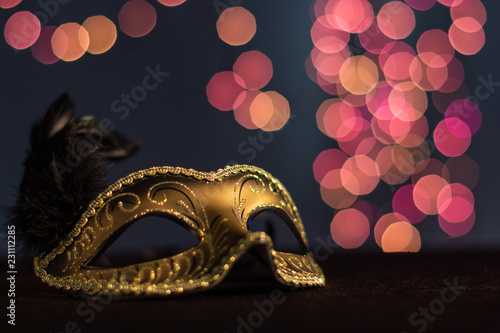 Carnival mask on the background of festive lights.