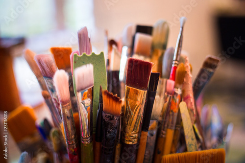 paint brushes in a vase