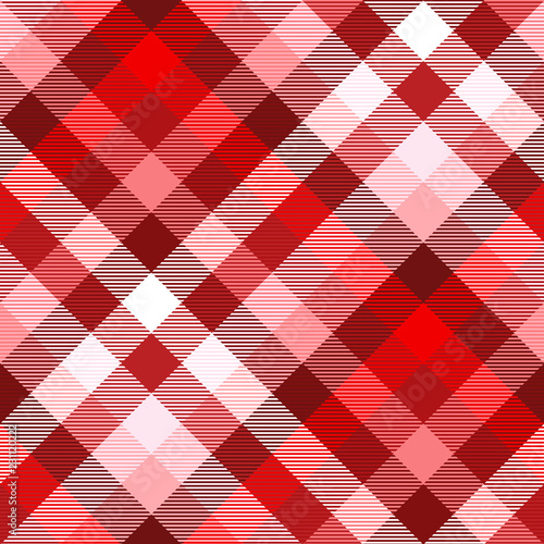 Plaid pattern in shades of red, burgundy, pink and white. Seamless fabric texture.