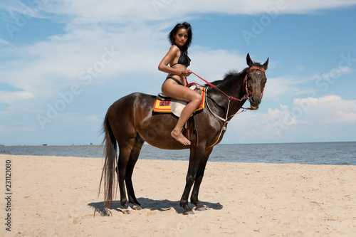 Sexy girl riding horse at beach. Fair tan skin and smooth. Stock Photo |  Adobe Stock
