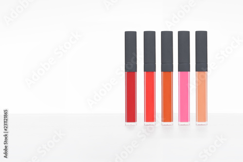 Set of lips in glass container on white background