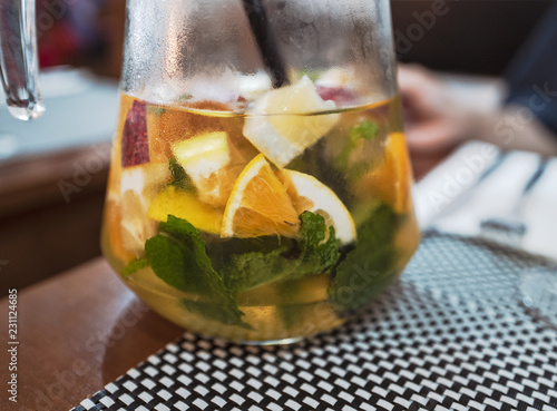 A jug of white sangria with fresh fruits