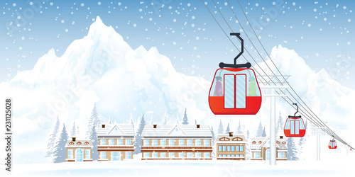 Ski resort with cable cars or aerial lift against mountains and house in the snowy forest.