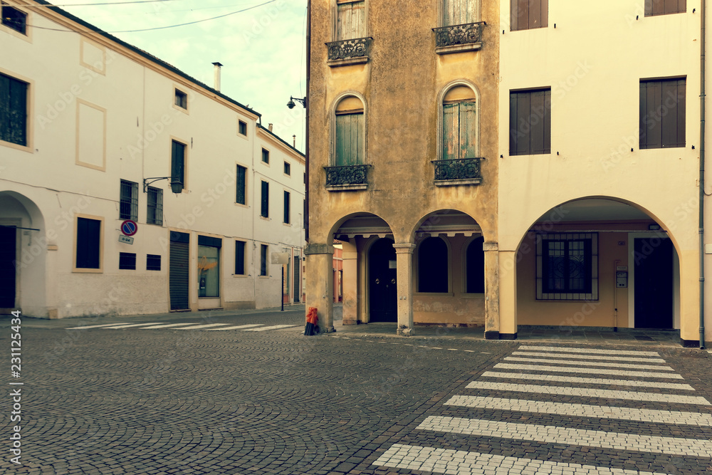Montagnana, Italy August 6, 2018: Beautiful city street with parked cars.