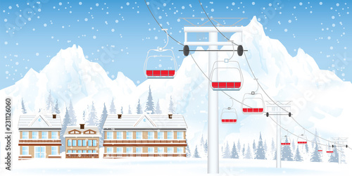 Winter ski resort with ski-lift moving above the ground against winter landscape with mountains and house.
