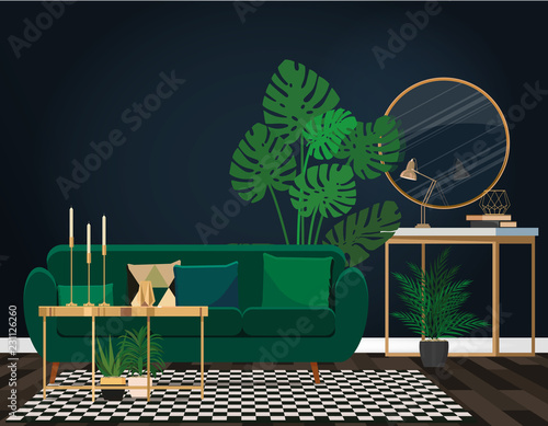 Emerald sofa against a dark blue wall with a mirror.