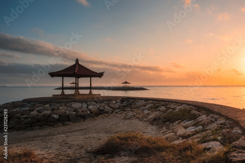 Bali pavilion on jetty at coastline in morning