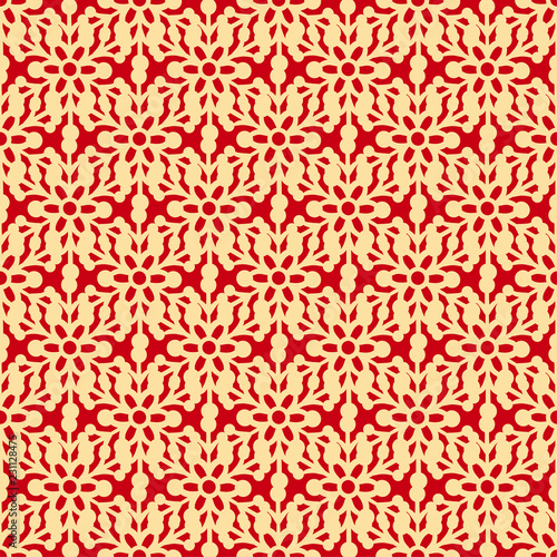 Seamless pattern with yellow snowflakes and on a red background