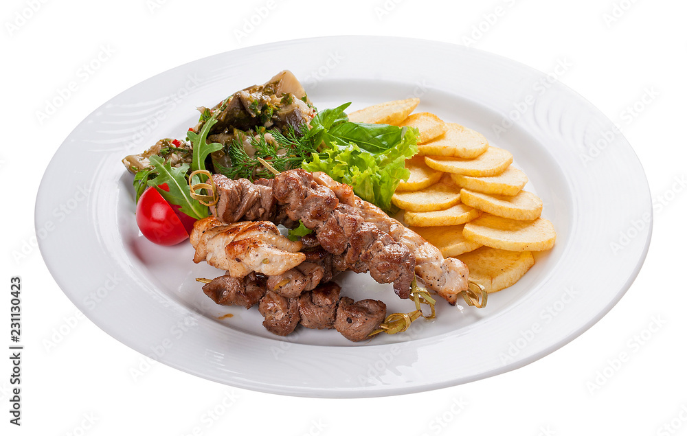 Set of kebabs with vegetable garnish on a white plate