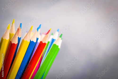 Pencils colorul color wooden pencil in metal holder in front of wall background