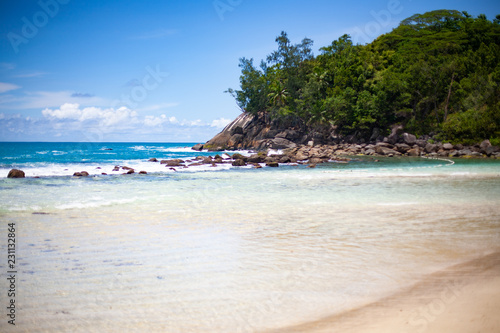 Landscape photo of beautiful white sand exotic beach on Mahe island in Seychelles © Happy Moments 