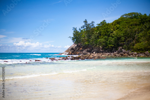 Landscape photo of beautiful white sand exotic beach on Mahe island in Seychelles
