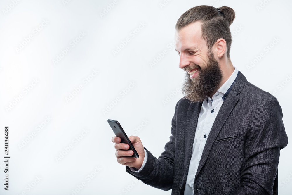 smiling man using mobile phone. technology communication and modern gadgets. smiling man using mobile phone. technology communication and modern gadgets.
