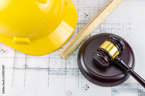 Gavel and yellow safety helmet