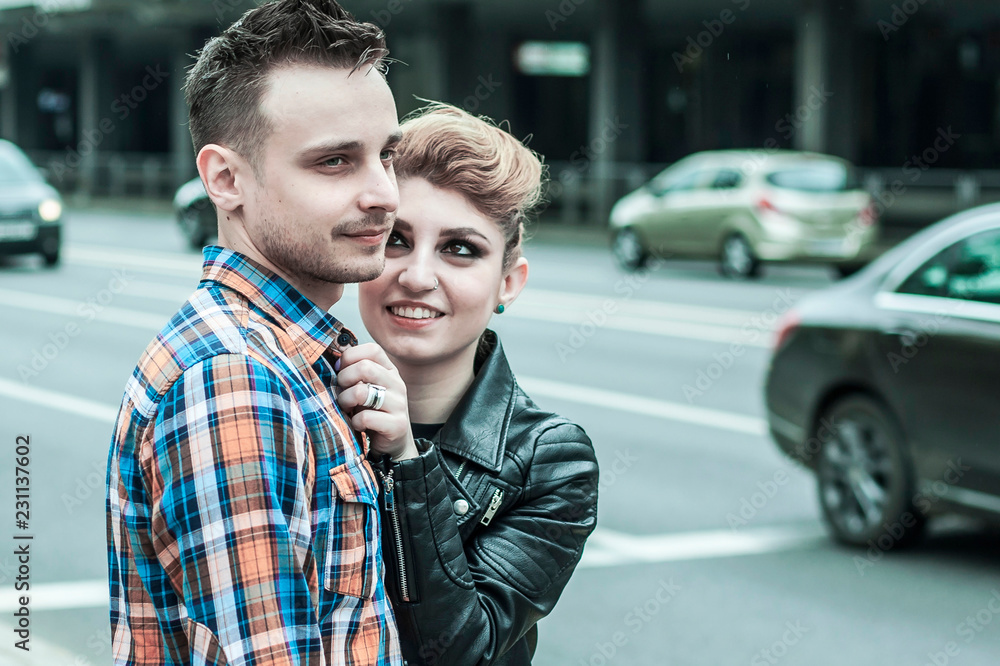 loving couple standing near the crosswalk in the big city loving couple standing near the crosswalk in the big city