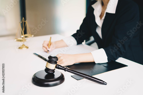 Professional female lawyers working at the law firms. Judge gavel with scales of justice. Legal law, lawyer, advice and justice concept.