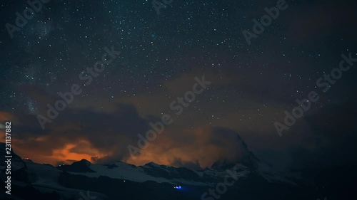 4K time lapse of Beautiful night sky of the famous Matterhorn pyramid under milky way and all the star. Great reflection night scene in Swiss Alps, Zermatt, Switzerland, Europe