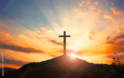 Christmas concept: Crucifixion Of Jesus Christ Cross At Sunset photo