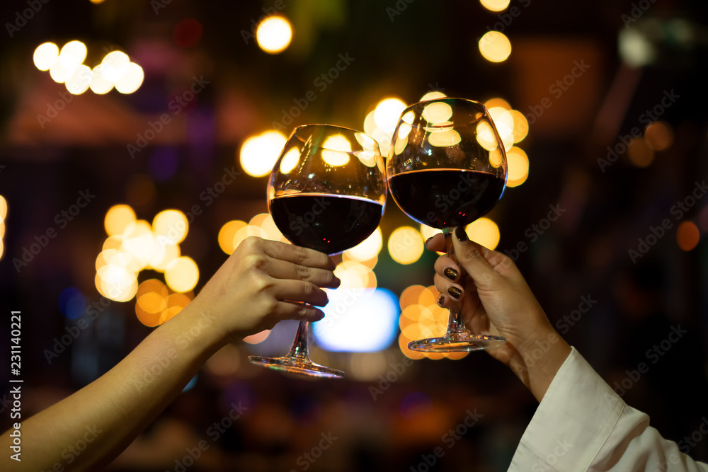 Φωτογραφία Women with friend celebrating Christmas party dinner with clinking glass of wine in Night Club