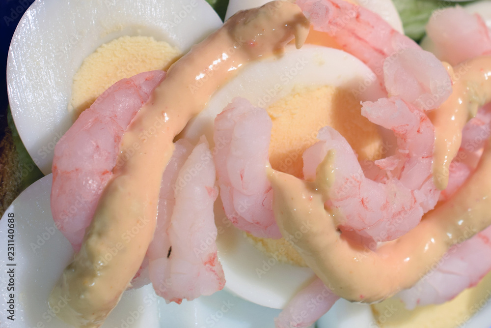 Fototapeta premium Sandwich toppings: boiled egg, shrimps and mayonnaise. Close up top view.