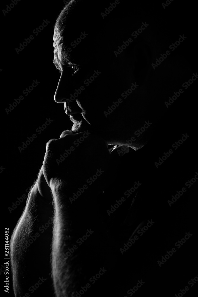 Adult bald man thinking, silhouette, close-up
