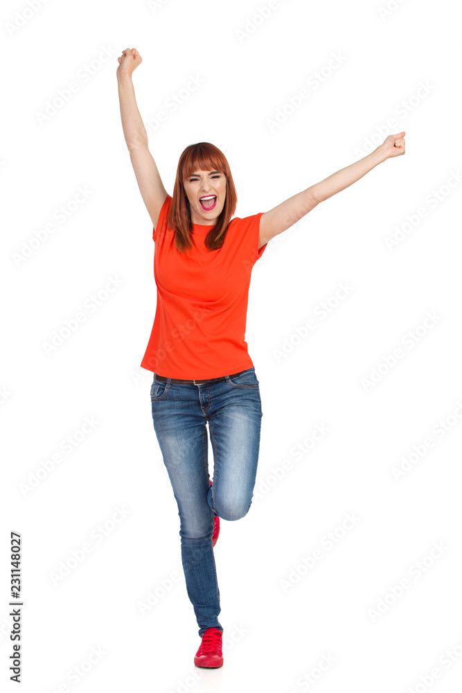 Casual Young Woman Is Standing On One Leg And Shouting