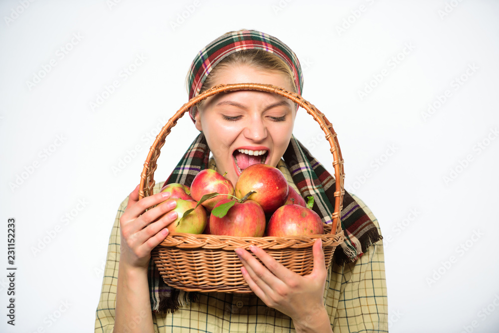 Woman gardener rustic style hold basket with apples on white background. Woman villager carry basket natural fruits. Lady farmer gardener care about vitamin healthy nutrition. Healthy dieting concept Woman gardener rustic style hold basket with apples on white background. Woman villager carry basket natural fruits. Lady farmer gardener care about vitamin healthy nutrition. Healthy dieting concept