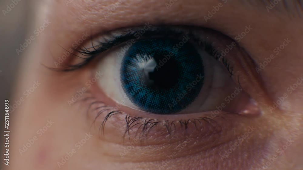 Macro image of human eye close up with contact lens blue color Macro image of human eye close up with contact lens blue color
