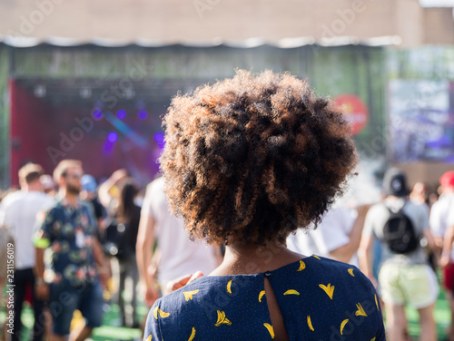 a persona looking at the music festival photo