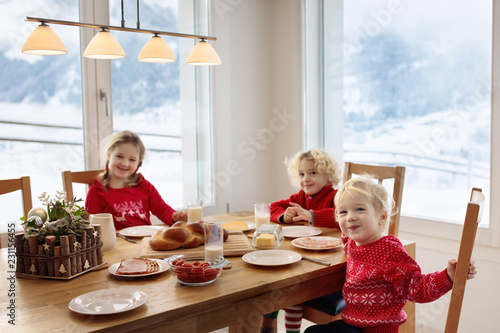 Kids breakfast in winter. Christmas meal at home. photo